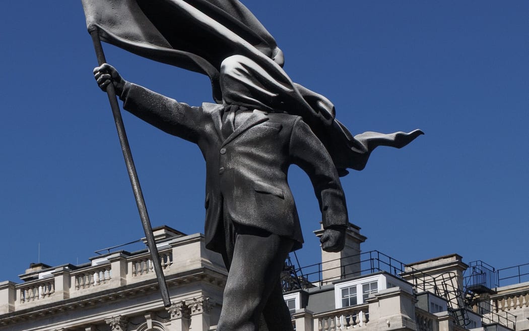 The statue, which Banksy claimed credit for on April 30, is an apparent commentary on the notion of blind patriotism.