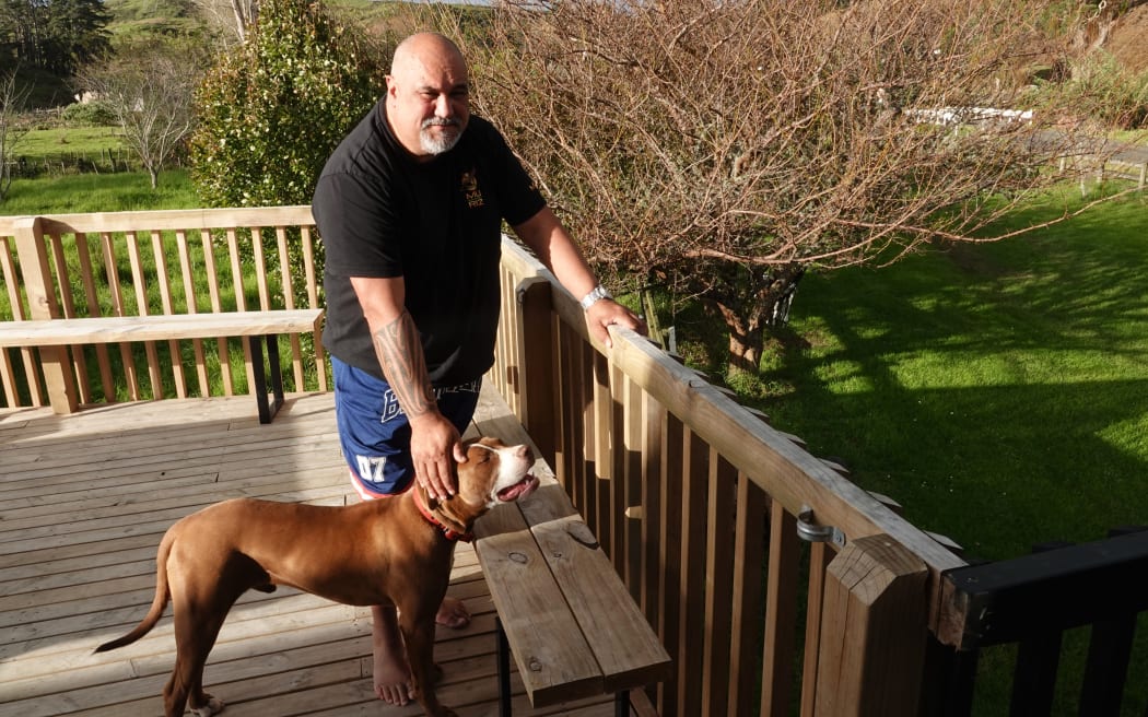 Shane Wikaira, with Kara the dog, raised his home by two metres after the 1999 flood.