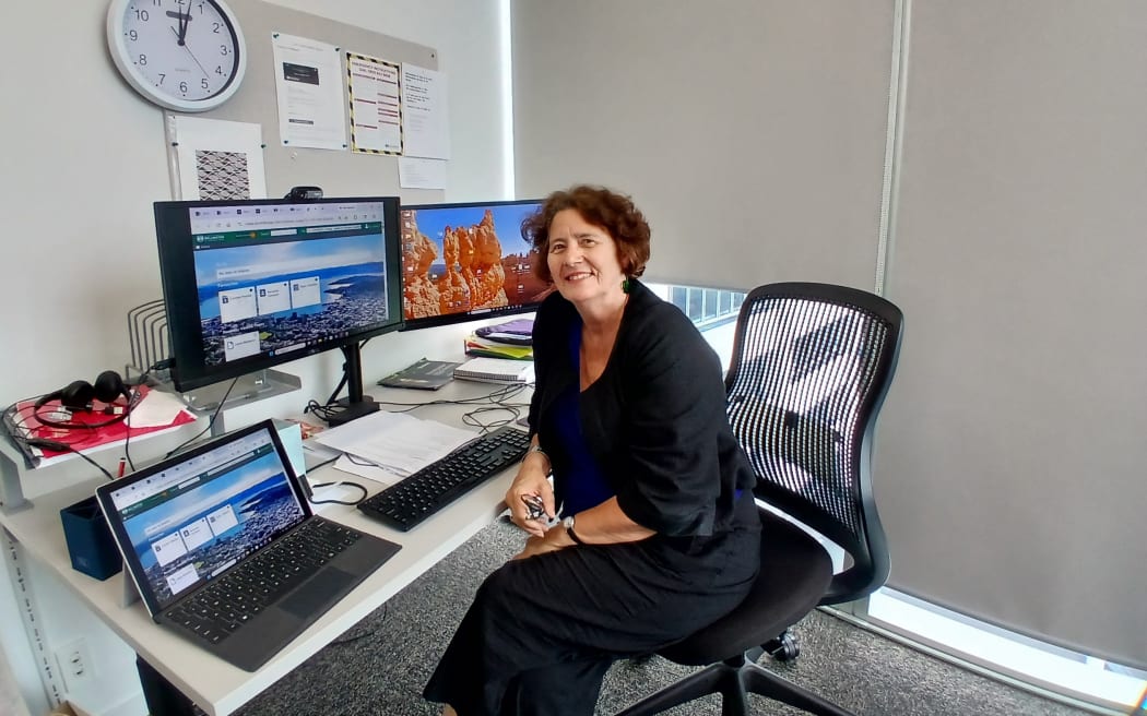 Professor Bev Lawton sitting at her desk