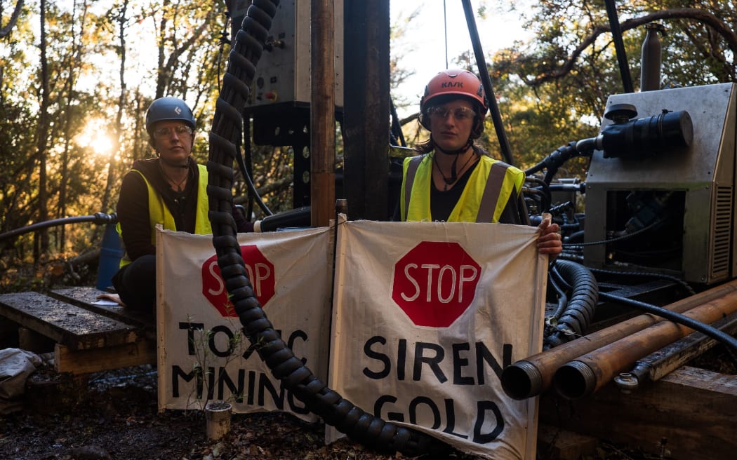 Two activists, identified only as Zanna and Aine, briefly chained themselves to one of the drills in the Sams Creek area over the weekend.