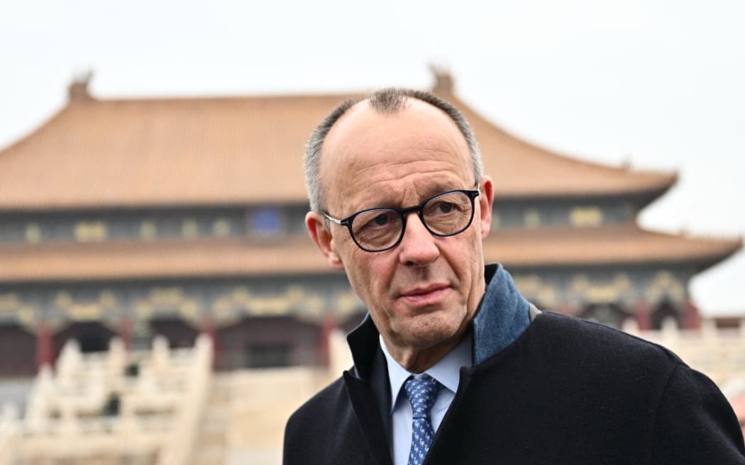 German Chancellor Friedrich Merz visits the Forbidden City in Beijing on February 26, 2026. (Photo by Pedro Pardo / AFP)