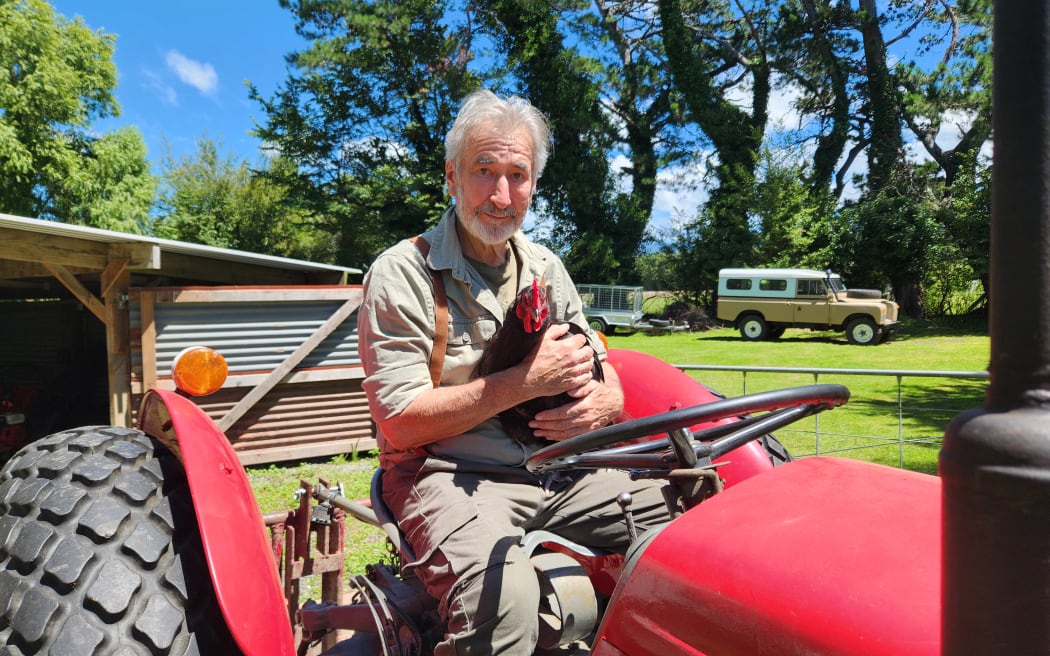 William Kircher sitting on his 1950s Massey Ferguson tractor with 