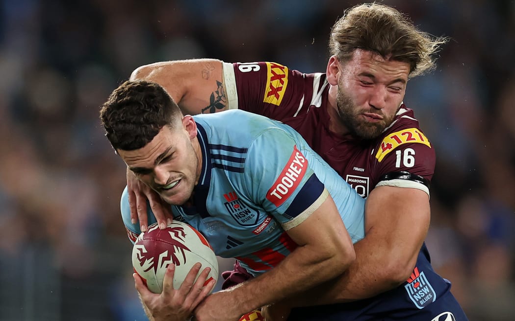 SYDNEY, AUSTRALIA - JULY 09: Nathan Cleary of the Blues is tackled by Patrick Carrigan of the Maroons during game three of the Men's State Of Origin series between New South Wales Blues and Queensland Maroons at Accor Stadium on July 09, 2025 in Sydney, Australia. (Photo by Cameron Spencer/Getty Images)
