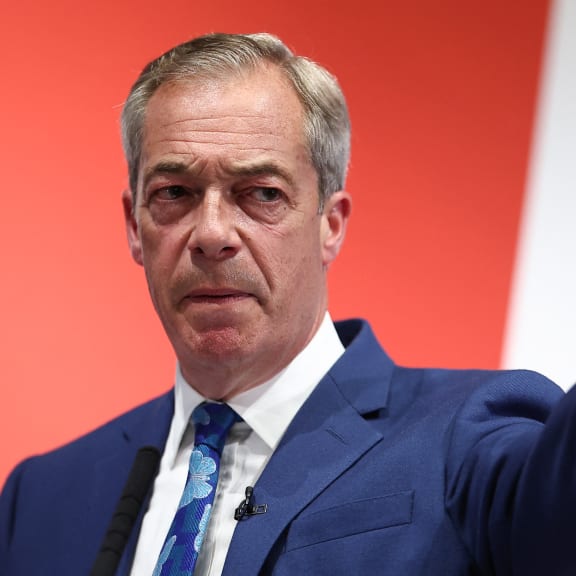 Honorary President of the Britain's right-wing populist party Reform UK and newly appointed leader Nigel Farage answers journalists during a campaign meeting, on June 3, 2024, ahead of the UK general election of July 4.