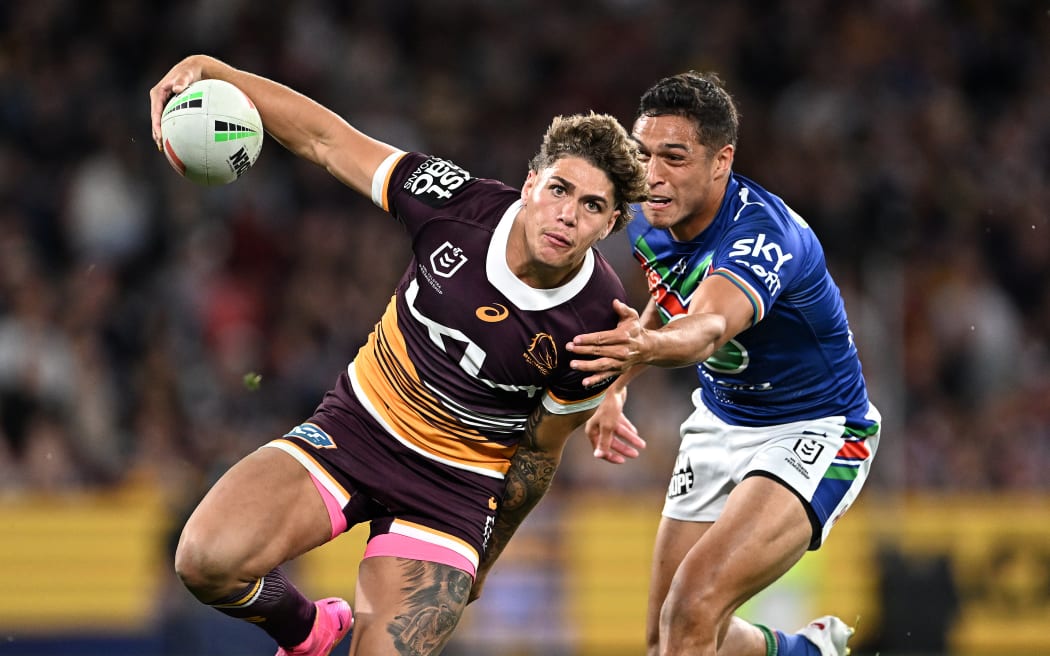 Broncos player Reece Walsh gets past Te Maire Martin of the Warriors during the NRL preliminary final between the Brisbane Broncos and the New Zealand Warriors at Suncorp Stadium in Brisbane, Saturday, September 23, 2023. (AAP Image/Dave Hunt/www.photosport.nz)