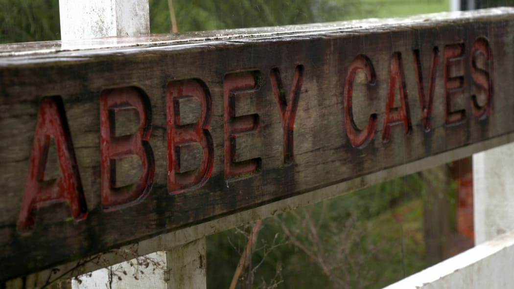 The rain soaked sign outside Abbey Caves