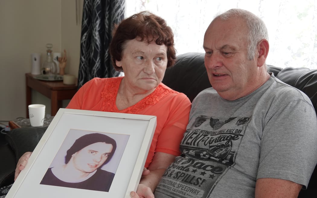 Evelyn and Greg Pike hold a photo of their son Nicholas, who was killed on March 18, 2002.