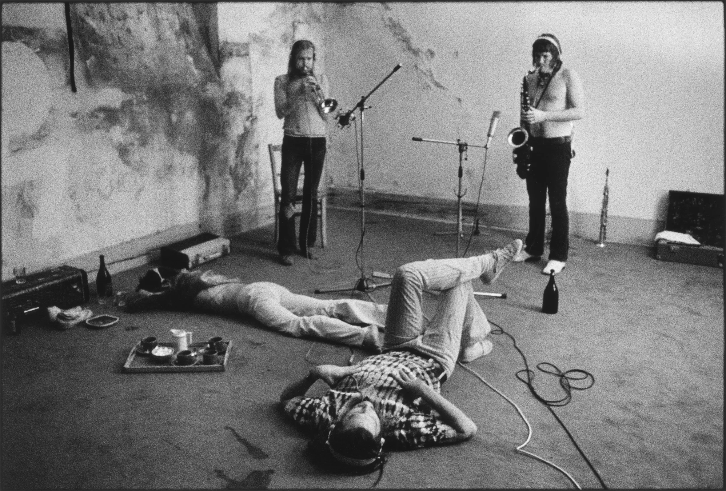 Bobby Keys and Jim Price recording horn parts for The Rolling Stones song "Bitch" (Sticky Fingers, 1971), with Keith Richards and producer Jimmy Miller resting on the floor.