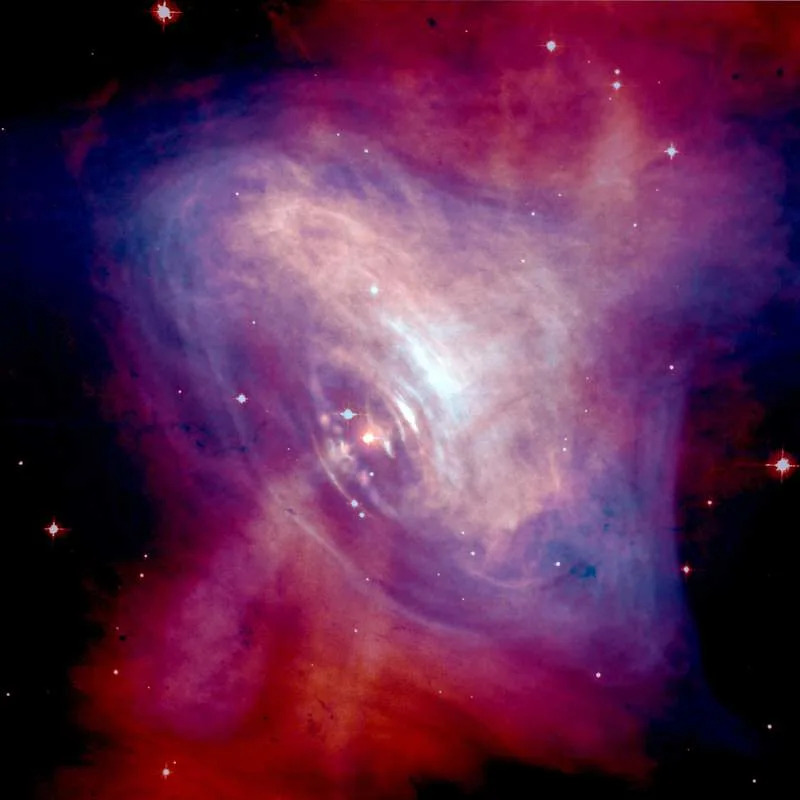 A composite image of the Crab Nebula showing the X-ray (blue), and optical (red) images superimposed. (CREDIT: NASA/HST/ASU/J. Hester et al. X-Ray: NASA/CXC/ASU/J. Hester et al.)