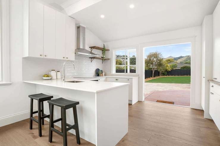 A three-bedroom villa on Corson Avenue, in Beckenham, Christchurch, was sold under the hammer for <img.305m, shattering expectations by more than $200,000. Photo / Supplied