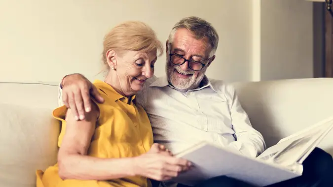 A senior or retired couple going over their finances to look at budget, spending, retirement plans and more.