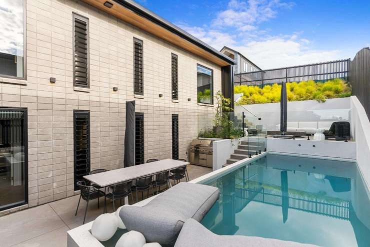The new owner of this five-bedroom home at 12 Grand Ridge Drive, in Auckland's Flat Bush, could also be taking possession of a 2021 Lamborghini Huracan EVO RWD. Photo / Supplied