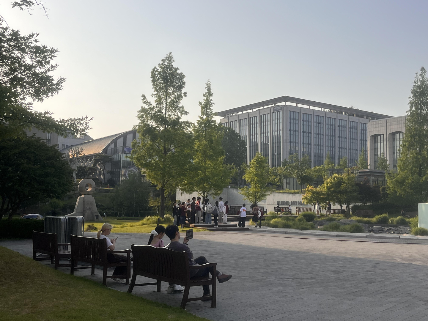 Students on their phones at Yonsei University in Sinchon-dong in central Seoul on May 15. [Fergus Goodall Smith]