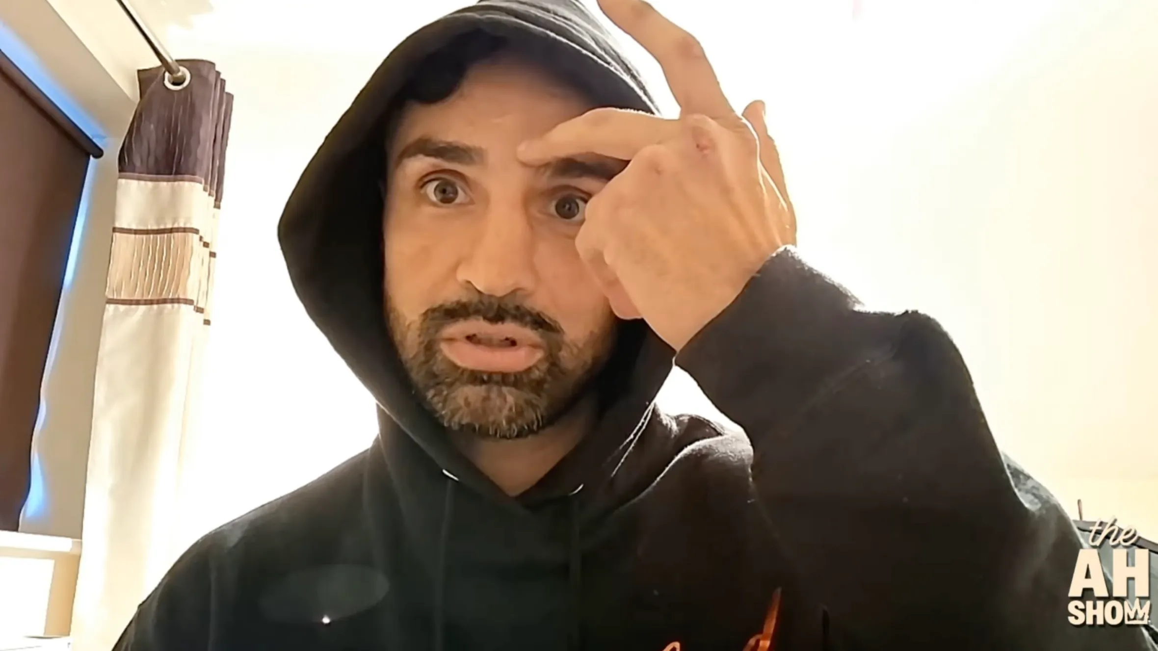 Paulie Malignaggi points to an injury above his eye.