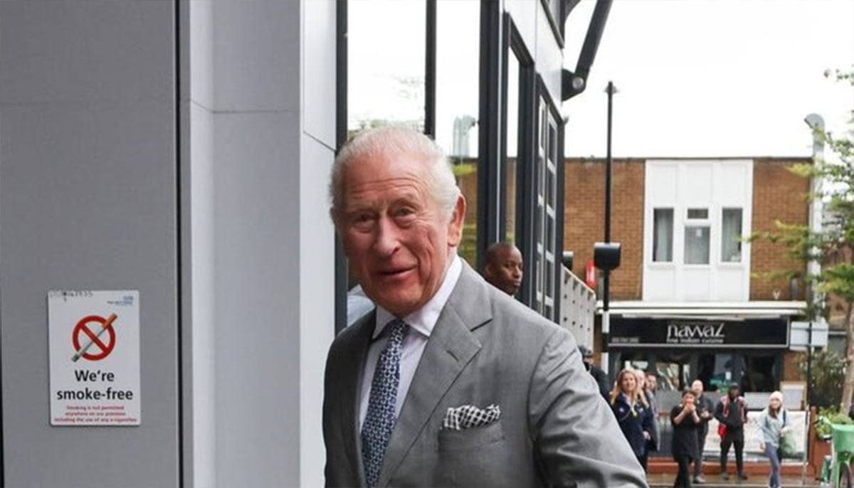 Smiling King Charles arrives in London