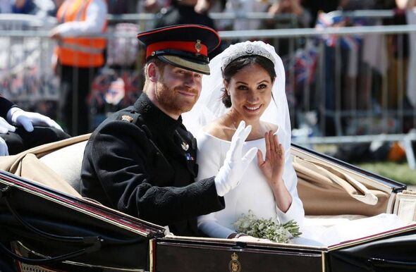 An image depicts a newlywed couple traveling in a carriage. The groom, dressed in a military uniform, is accompanied by the brid An image depicts a newlywed couple traveling in a carriage. The groom, dressed in a military uniform, is accompanied by the brid