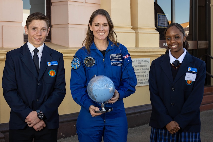 An astronaut with high school students in Kalgoorlie.  
