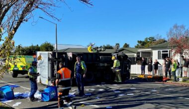 Truck rolls, scattering paper debris over Hastings street