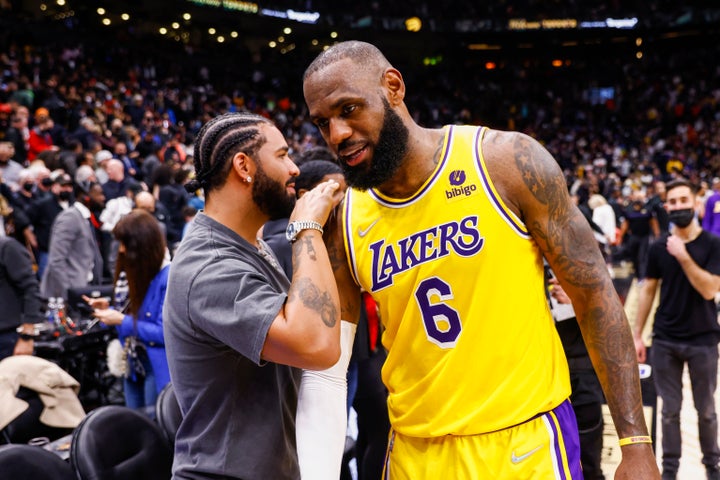 LeBron James talks to Drake after the Los Angeles Lakers game against the Toronto Raptors on March 18, 2022, at the Scotiabank Arena in Toronto.
