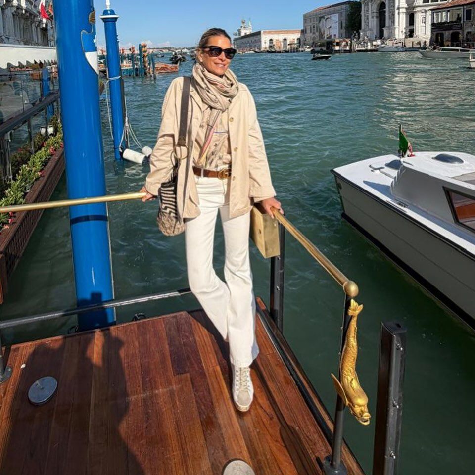 Image may contain Person Standing Clothing Pants Adult Accessories Bag Handbag Sleeve Belt and Boat