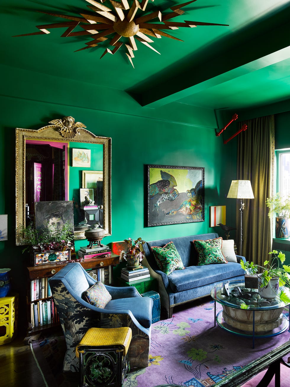 Stylish living room with vibrant green walls.