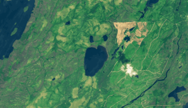 Looped satellite photos showing before and after a face-shaped Canadian lake completely emptied