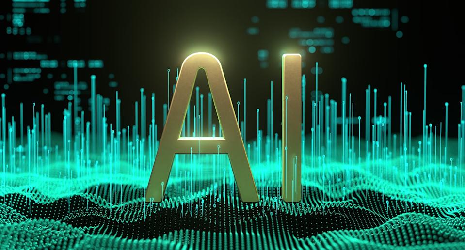 The letters AI standing amid a technological landscape.