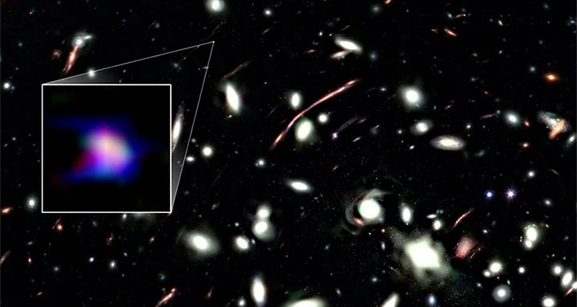 A deep space photo with a boxout to the left encircling a smear of blue and purple light.