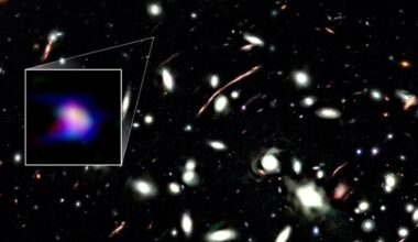 A deep space photo with a boxout to the left encircling a smear of blue and purple light.