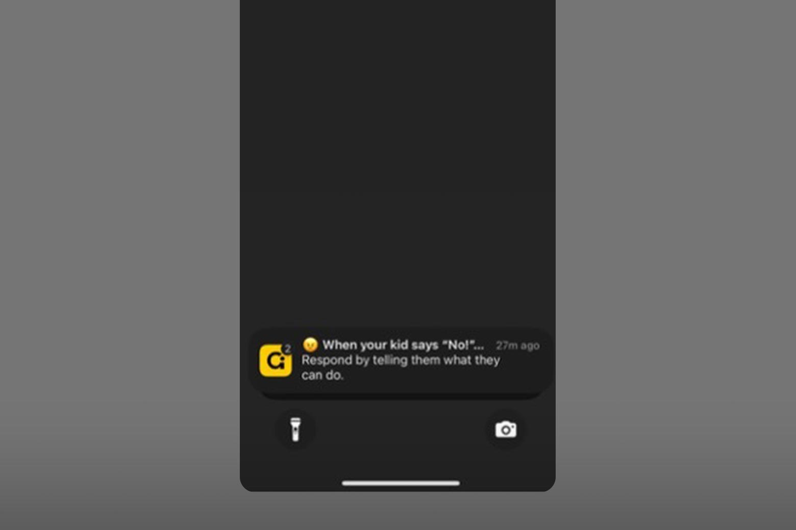 A phone's sleep screen, with a notification from the Good Inside app that reads: "When your kid says no!"