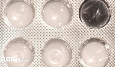 Close up of a blister pack of white tablets with one of the windows empty. The plastic package which features a dimpled, foil wrapper, contains five round tablets.