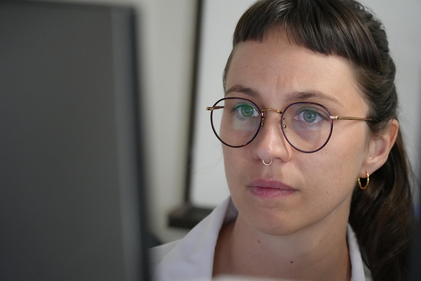 Scientist looks intently at computer screen