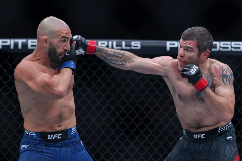 NEWARK, NEW JERSEY - MAY 09: Jim Miller of the United States, (R), punches Jared Gordon of the United States in a lightweight fight during UFC 328 at the Prudential Center on May 09, 2026 in Newark, New Jersey. Ishika Samant/Getty Images/AFP (Photo by Ishika Samant / GETTY IMAGES NORTH AMERICA / Getty Images via AFP)