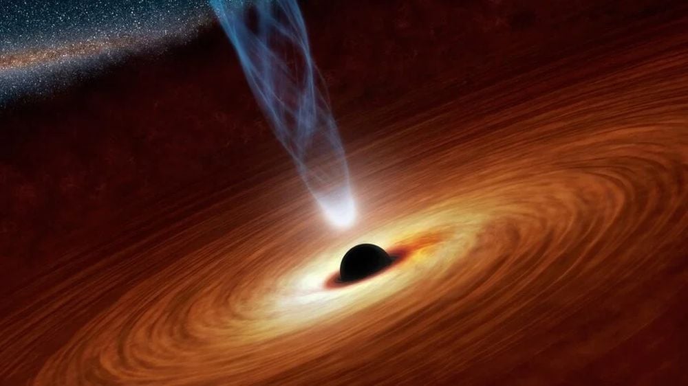 This artist's illustration shows a spinning SMBH at the center of its AGN. New research shows how AGN affect exoplanet habitability. The powerful energy can strip away atmospheres and ozone at great distances, shaping habitability in large portions of a galaxy. Image Credit: National Aeronautics and Space Administration / Jet Propulsion Laboratory-Caltech.