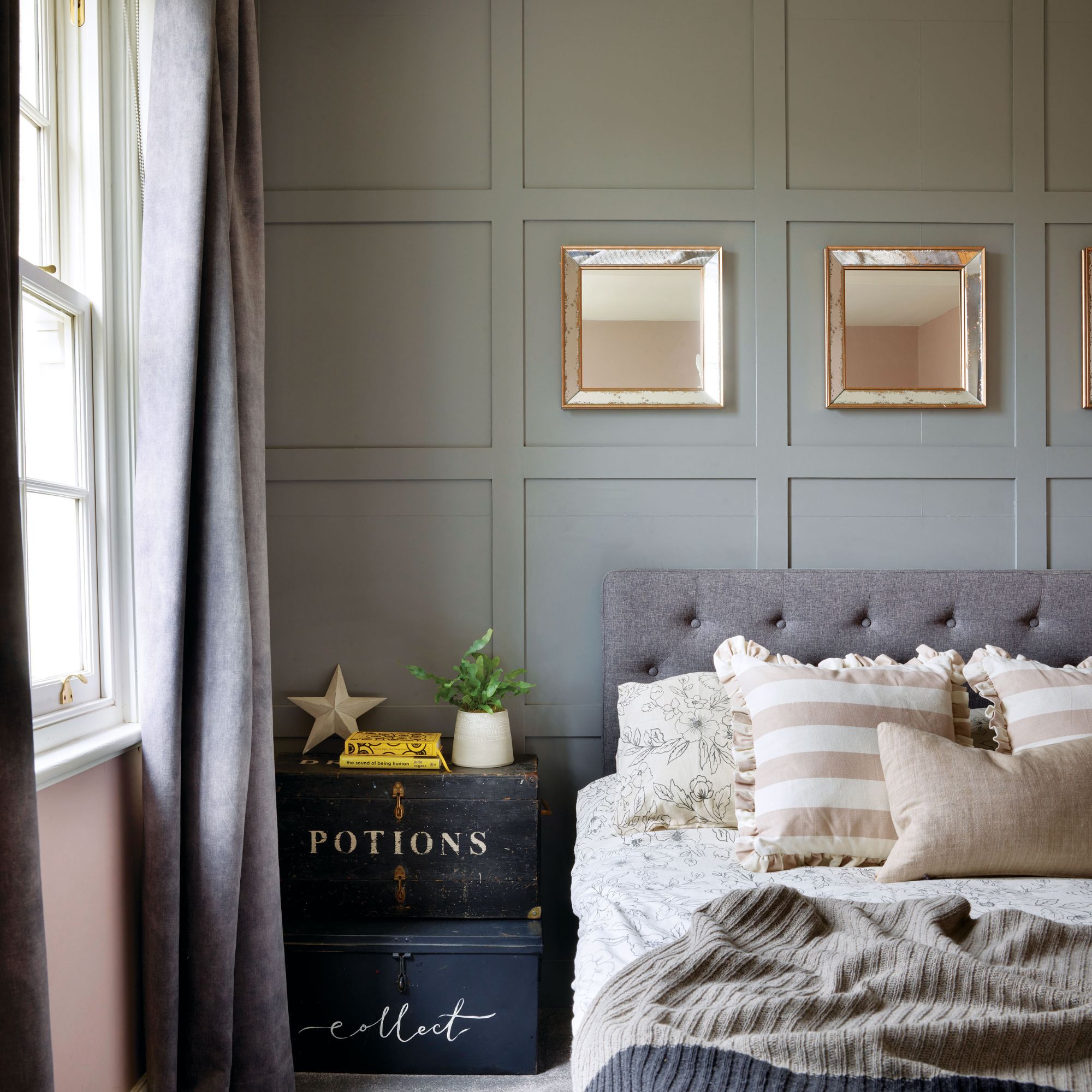 Teenagers bedroom with wall panelling and boxes as bedside table