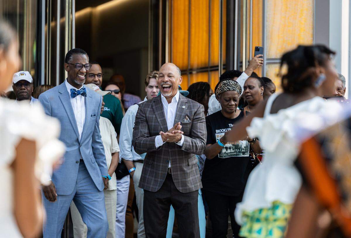 Gene Woods, chief executive officer of Advocate Health, cheers on a performance during the 2025 grand opening of The Pearl. 