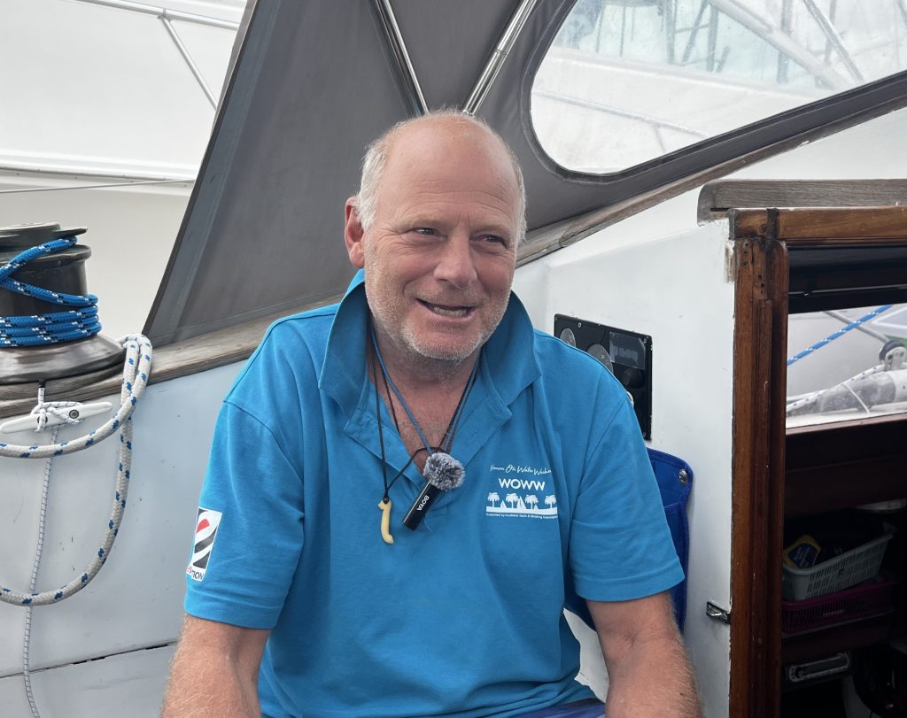 Doug Esterman sitting in the cockpit of his Salthouse Cavalier 39, Fair Seasons // Photo credit: Boating New Zealand