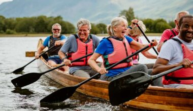 A senior group of friends enjoying rowing on the River Derwent