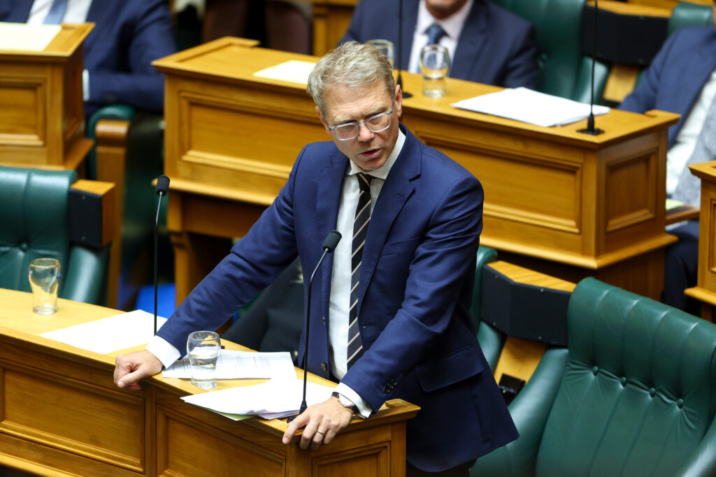 New Zealand Justice Minister Paul Goldsmith speaks during a Parliament session on March 6, 2024, in Wellington. Credit: Hagen Hopkins/Getty Images