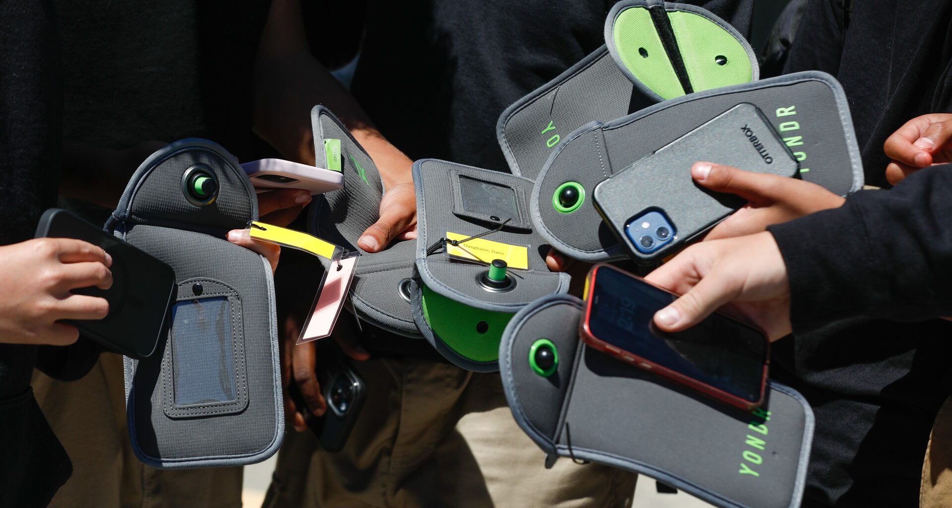 They started popping up in schools. Now, they’re showing up in the workplace. Cellphone bans and locked phone pouches are gaining popularity.