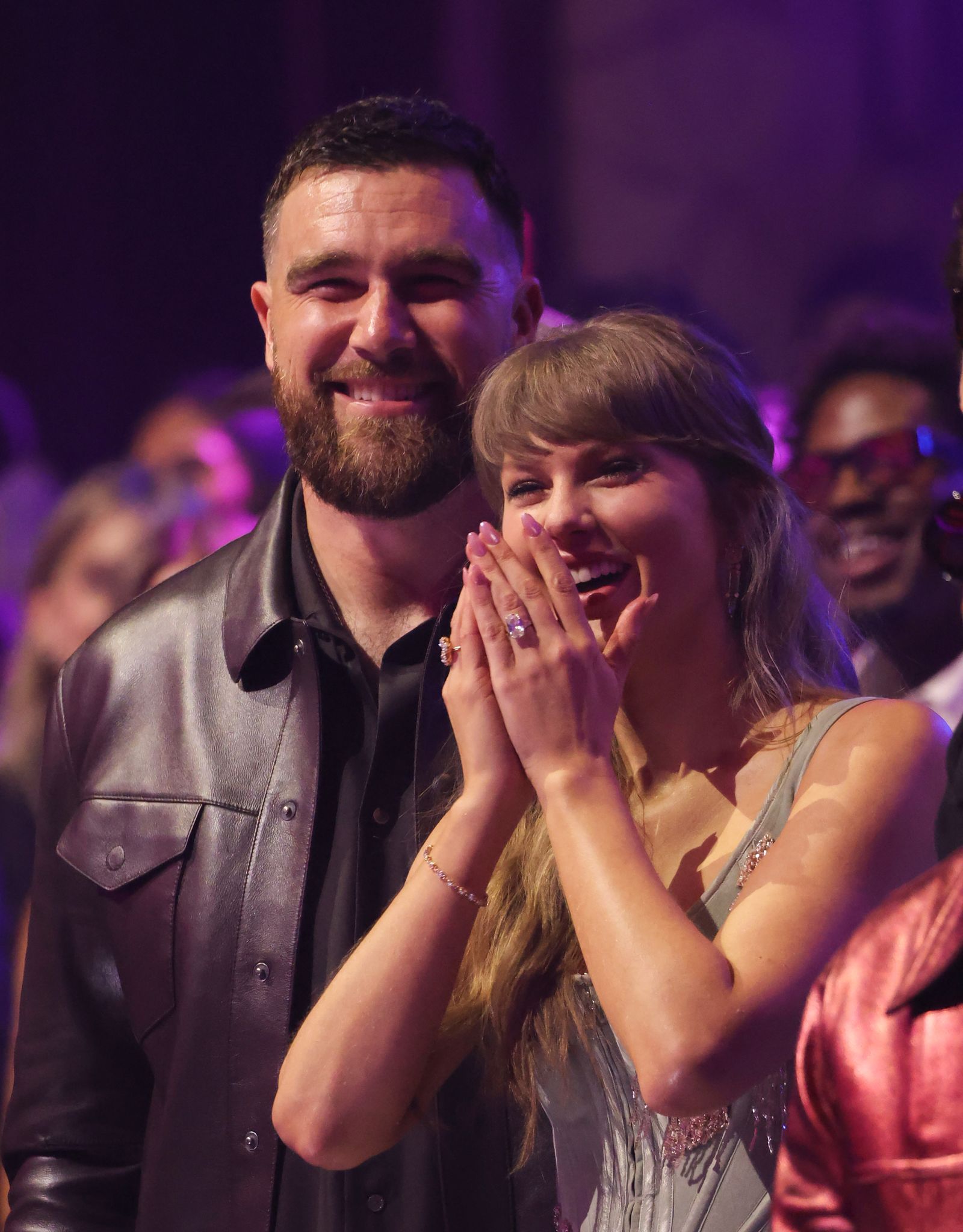 Image may contain Travis Kelce Taylor Swift Head Person Face Adult Happy Clothing and Coat