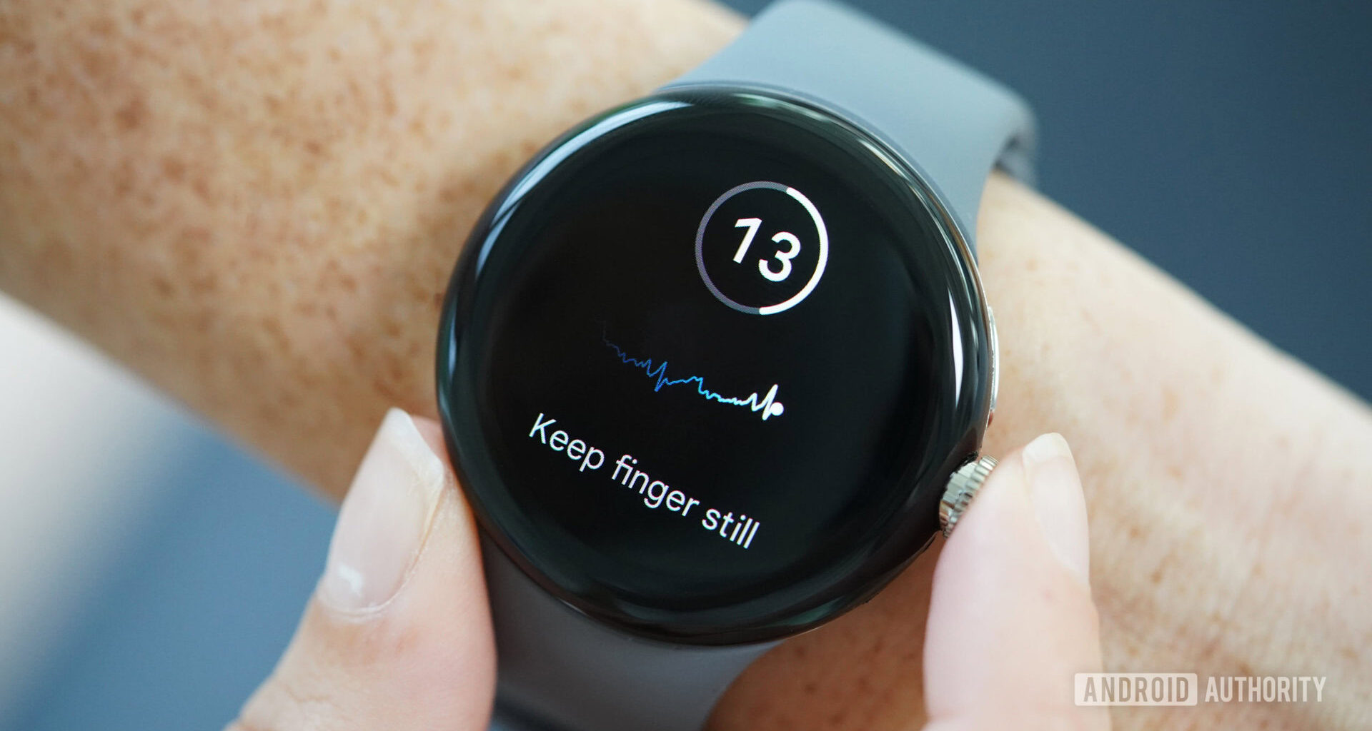 A user takes an ECG reading on their Google Pixel Watch.