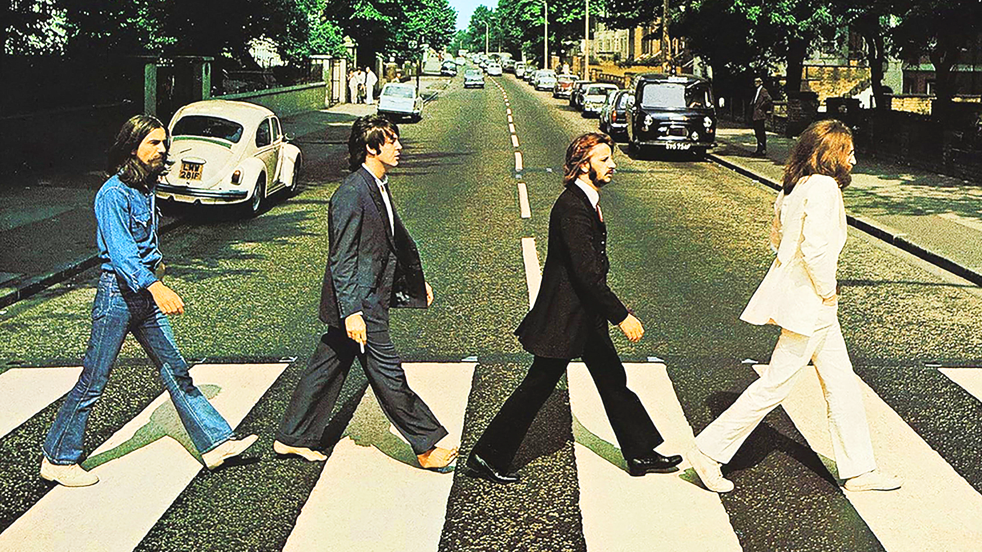 Abbey Road cover of the Beatles walking toward their future