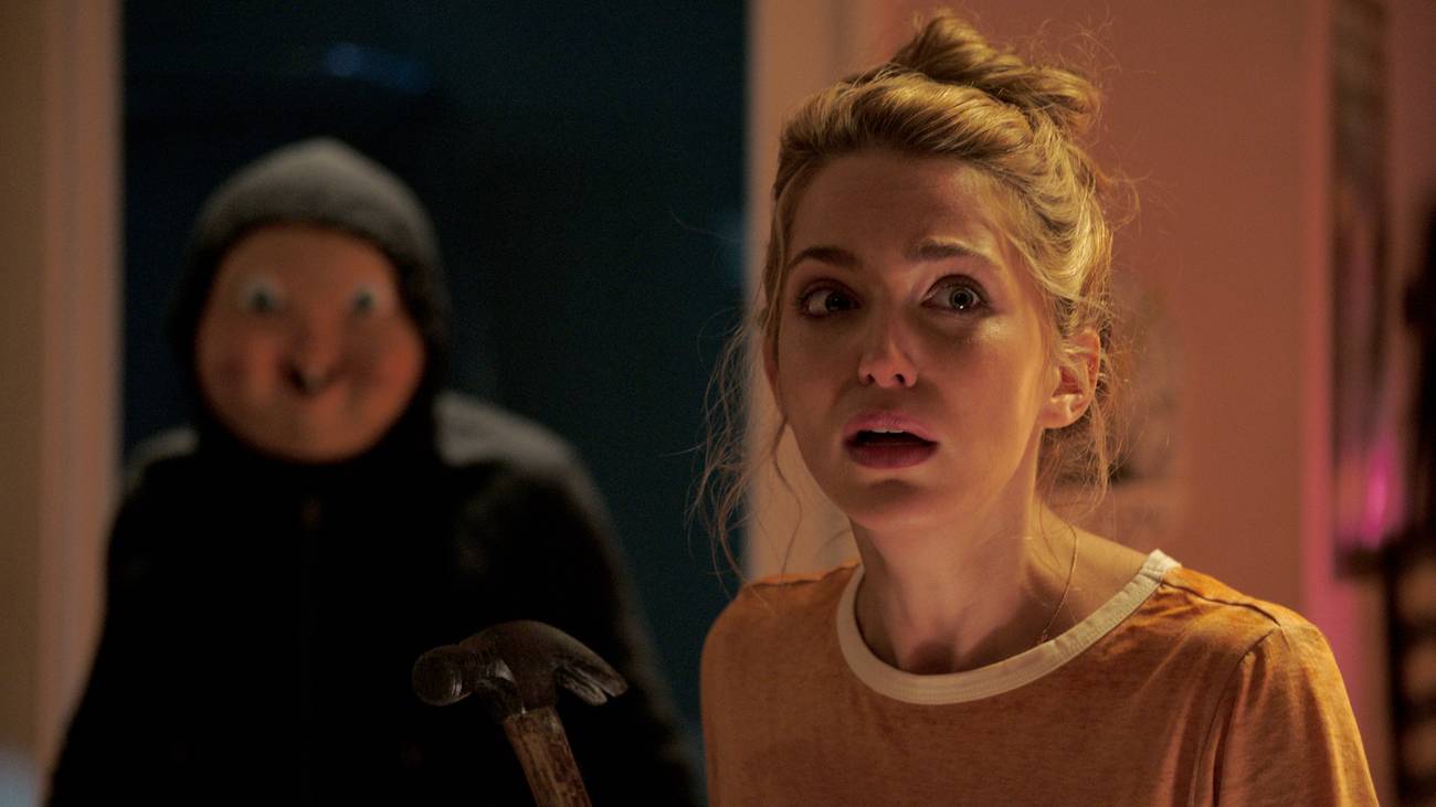Jessica Rothe and the masked killer in Happy Death Day (2017)