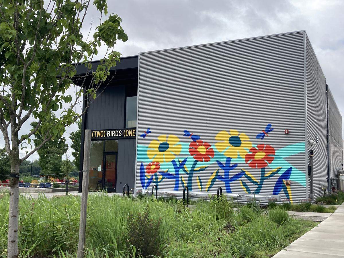 A mural of flowers went up at the Two Birds One Stone beer garden on Memorial Day weekend, 2026.