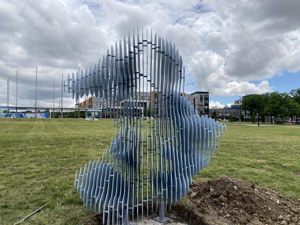 Composed of 40 layers of steel sheets, Ben Butler’s sculpture, “Rivercloud,” installed Friday, May 20, 2026, at Berkley Riverfront Park, changes appearance from solid to nearly see-through depending on perspective.