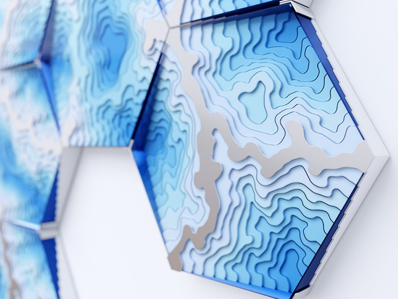 Abstract blue hexagonal wall sculpture with layered contour patterns and 3D depth.