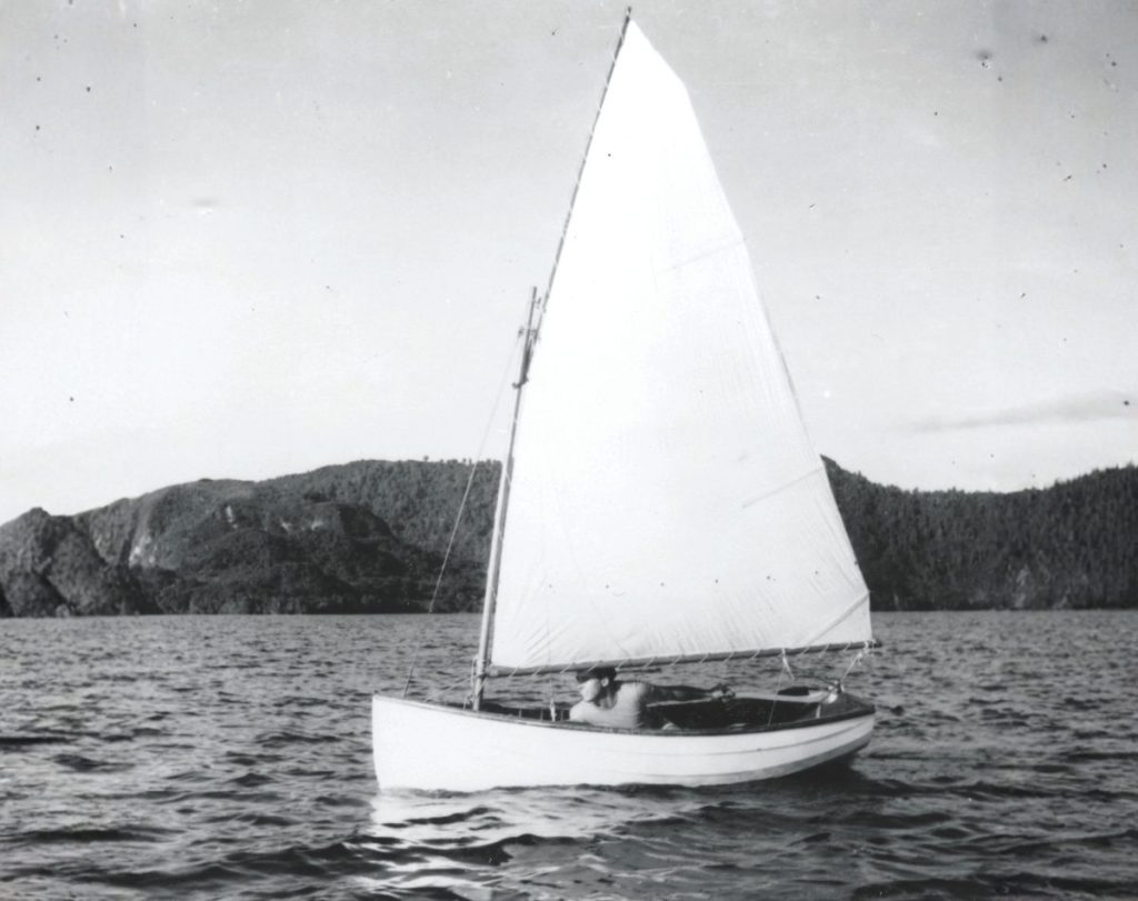 Young John Chapple sailing a dinghy on Lake Okareka.  // Harold Kidd and supplied