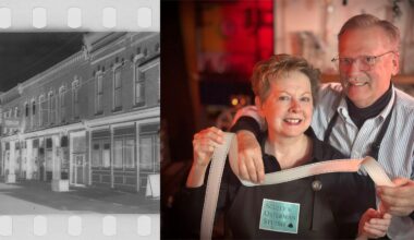 A grayscale negative image of a row of buildings is on the left. On the right, two smiling people hold a strip of photographic film in a studio, one wearing a "Scully Osterman Studio" name tag.