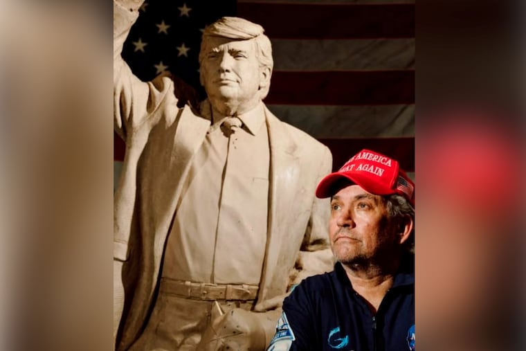 Steven C. Barber stands in front of the clay version of what would become the statue of President Donald Trump that he commissioned.